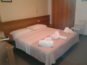 Postel nebo postele na pokoji v ubytování G/Hotel Lignano