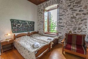 Posteľ alebo postele v izbe v ubytovaní Archontiko Montana