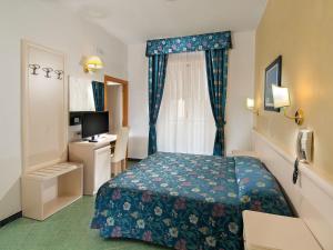 Postel nebo postele na pokoji v ubytování Hotel Nord Est