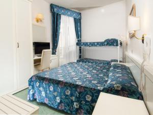 Postel nebo postele na pokoji v ubytování Hotel Nord Est
