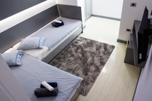 Postel nebo postele na pokoji v ubytování Apartments Petra