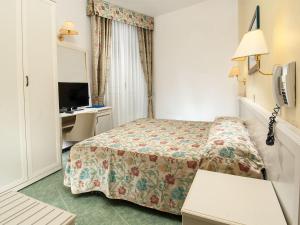 Postel nebo postele na pokoji v ubytování Hotel Nord Est
