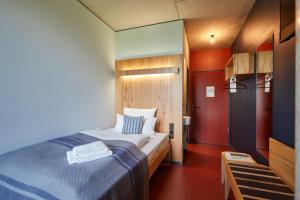 Postel nebo postele na pokoji v ubytování Hotel Rossi