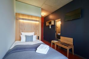 Postel nebo postele na pokoji v ubytování Hotel Rossi