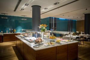 
a large kitchen with a large counter top at Hotel Atrium in Split
