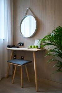 a dressing table with a mirror and a stool at Rabble in Edinburgh