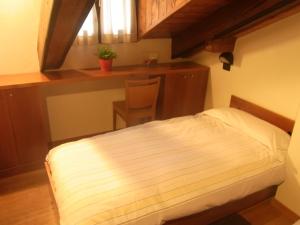 Postel nebo postele na pokoji v ubytování Casa Alpina Don Guanella