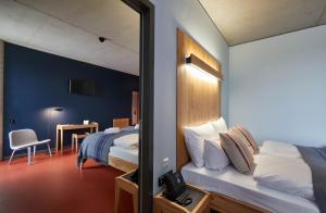 Postel nebo postele na pokoji v ubytování Hotel Rossi