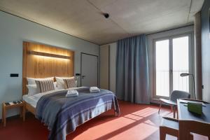 Postel nebo postele na pokoji v ubytování Hotel Rossi