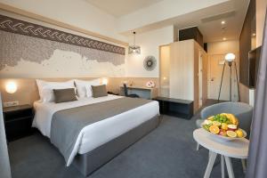 Postel nebo postele na pokoji v ubytování Hotel Salona Palace