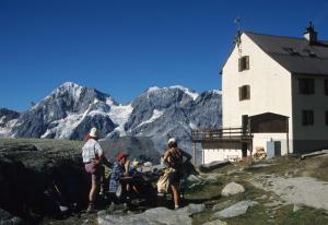 a group of people standing in front of a mountain at Hotel Mignon in Solda