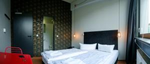 Cama ou camas em um quarto em WALLYARD Stay