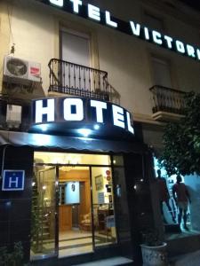 a hotel sign on the front of a building at Hotel Victoria in Zafra