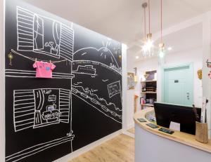 a wall with drawings on it in a room at Napoli Bonita b&b in Naples