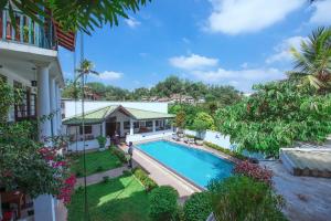 an aerial view of a house with a swimming pool at Kaya Residence Kandy in Kandy