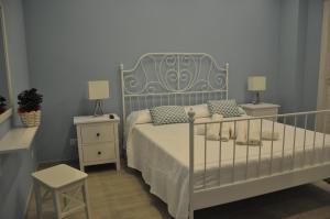 A bed or beds in a room at Ciao Ciao Rooms