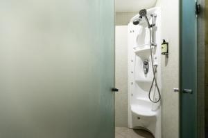 a bathroom with a shower and a toilet at Vale d'El Rei Hotel & Villas in Carvoeiro