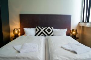 Cama ou camas em um quarto em WALLYARD Stay
