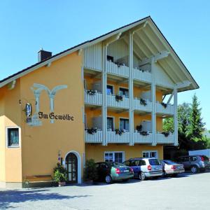 a building with cars parked in front of it at Im Gewölbe in Bad Füssing