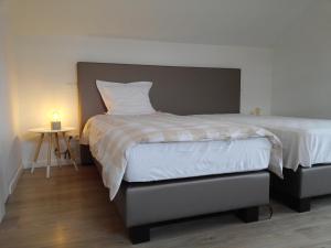 Säng eller sängar i ett rum på Pluimpapaver Hotel & Glamping