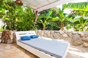 Vonkajšia záhrada v ubytovaní Relax tiny villas 40 meters of the beach