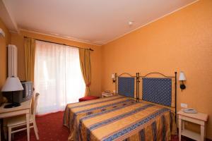 Postel nebo postele na pokoji v ubytování Hotel Campagna