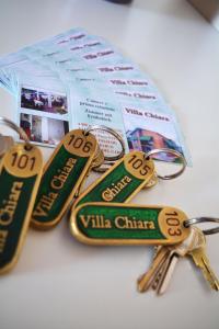 a group of keys on top of a package at Villa Chiara in Lazise