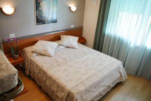 Postel nebo postele na pokoji v ubytování Villa Chiara