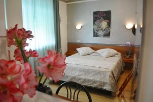 Postel nebo postele na pokoji v ubytování Villa Chiara