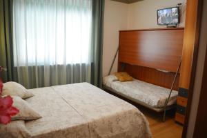 Postel nebo postele na pokoji v ubytování Villa Chiara