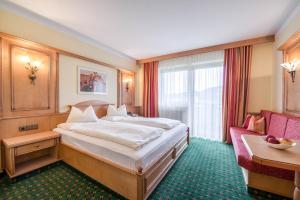 Letto o letti in una camera di Hotel Riedl