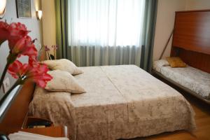 Postel nebo postele na pokoji v ubytování Villa Chiara