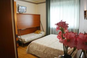 Postel nebo postele na pokoji v ubytování Villa Chiara