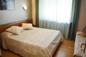 Postel nebo postele na pokoji v ubytování Villa Chiara