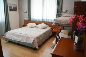 Postel nebo postele na pokoji v ubytování Villa Chiara