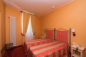 Postel nebo postele na pokoji v ubytování Hotel Campagna