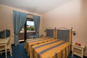 Postel nebo postele na pokoji v ubytování Hotel Campagna
