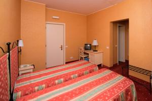 Postel nebo postele na pokoji v ubytování Hotel Campagna