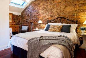 Ліжко або ліжка в номері Byronsvale Vineyard and Accommodation