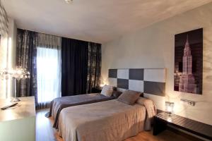 Postel nebo postele na pokoji v ubytování Dolcet L´Hotel + 37 fotografií