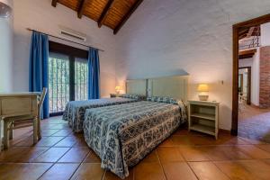 Posteľ alebo postele v izbe v ubytovaní Hacienda Roche Viejo + 37 fotografií
