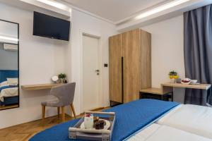 Postel nebo postele na pokoji v ubytování Central Rooms Split
