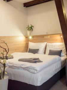 Postel nebo postele na pokoji v ubytování Club Apartments