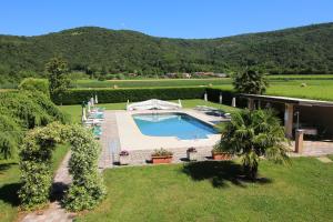 a house with a swimming pool in a yard at Ai Casali in Cividale del Friuli