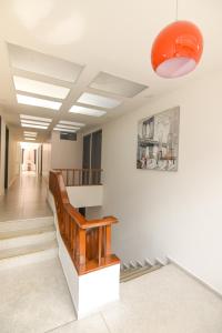 a hallway with stairs and an orange ceiling at Terraza Hotel Bogota in Bogotá