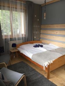 Posteľ alebo postele v izbe v ubytovaní Nosalove Apartamenty