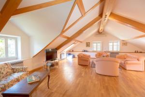 a living room with couches and a tv at Hedera Estate, House Hedera V in Dubrovnik