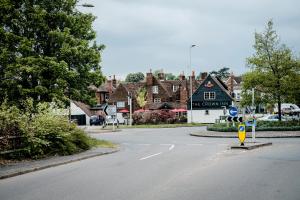 an empty street in a small town with houses at The Crown Inn in Bishops Waltham