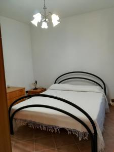 Un pat sau paturi într-o cameră la Casa Vacanze Bellavista