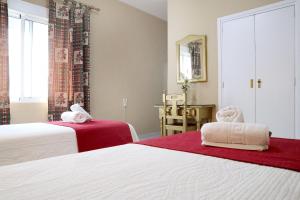 Postel nebo postele na pokoji v ubytování Hostal Victoria